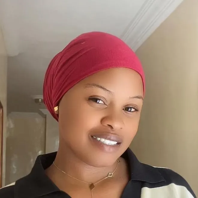 Portrait of Rita in a red head wrap
